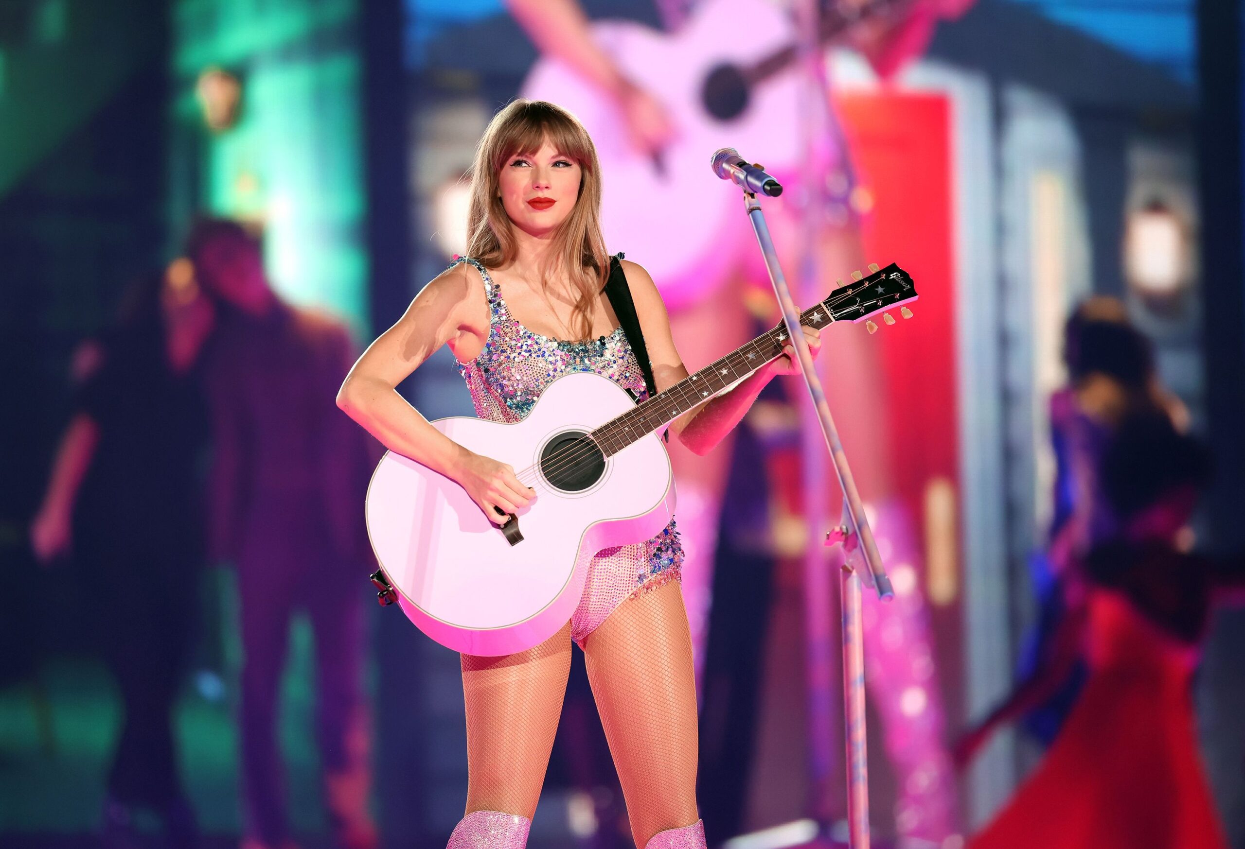 Swift performing on the stage of the Eras Tour