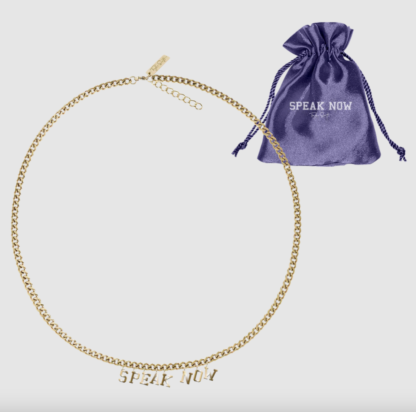 The Speak Now necklace and the small purple pouch it comes in